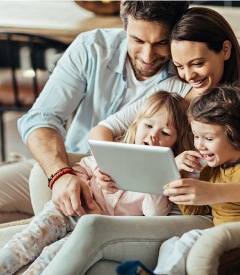 A beautiful family browsing  on a tablet